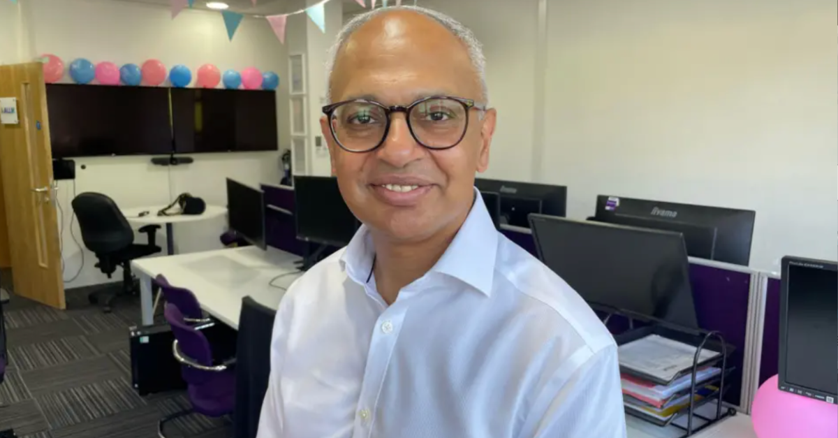 Gurdip Singh, Kallik CEO, in an office space smiling at the camera