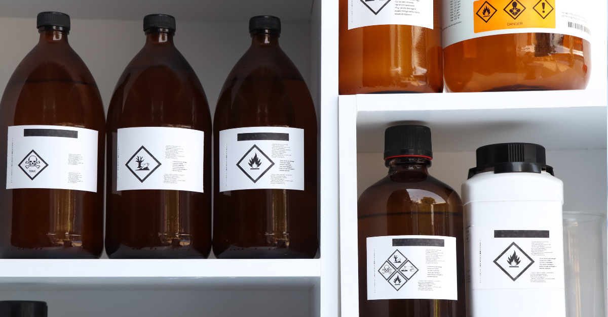 Bottles of hazardous substances with label symbols