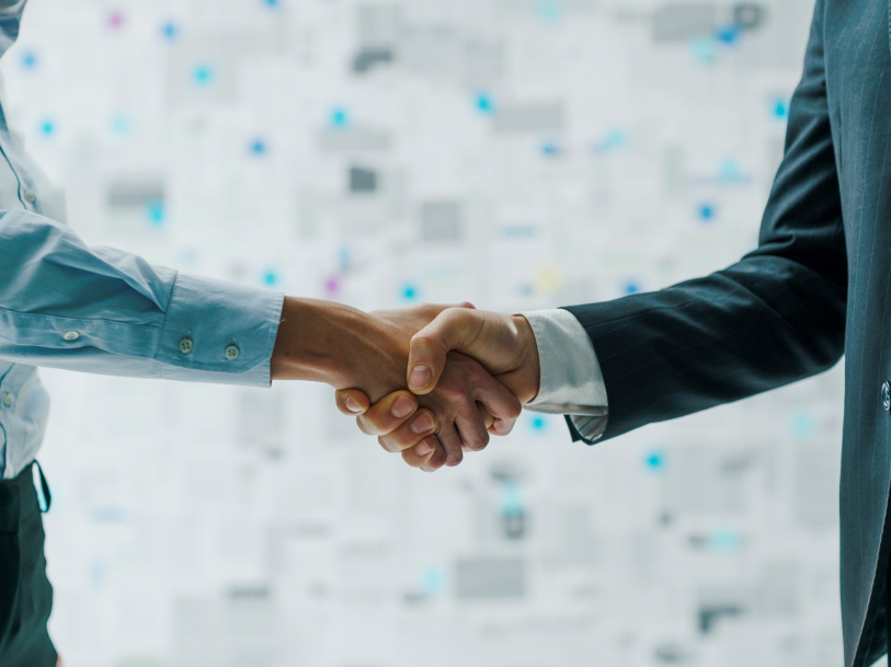 Two business people shaking hands