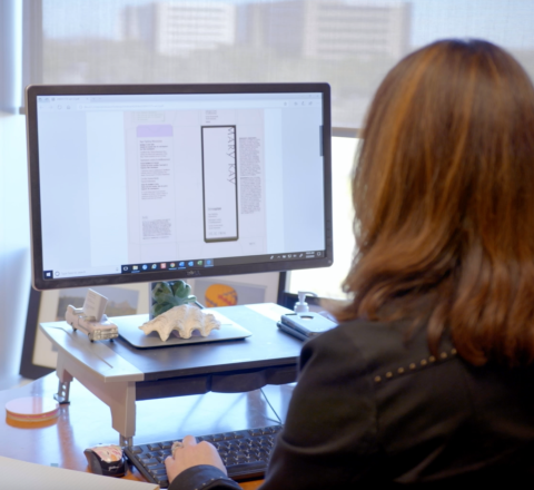 woman designing labels on computer