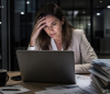 stressed business woman using laptop